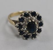 A 1970's 9ct gold, sapphire and diamond cluster dress ring, size L.