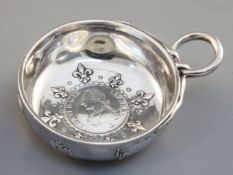 A silver wine taster, in French style, inset with a Louis XVI 1789 One Ecu coin, probably German,