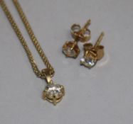 A gold and solitaire diamond set pendant on an 18ct gold chain and a pair of 18ct gold and solitaire