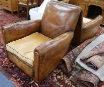 A pair of 1940's French tan leather armchairs, W.2ft 10in. D.3ft 1in. H.2ft 9in.