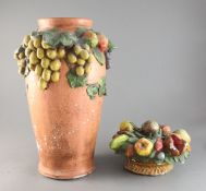 A Clare Sheridan painted plaster vase 15.5in. and a similar fruit group, 9in.https://www.gorringes.