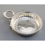 A French silver wine taster, 18th century, gadrooned and with snake handles, rim inscribed 'Estienne