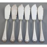 A set of six Victorian silver Old English shell pattern butter knives, Holland, Aldwinckle & Slater,