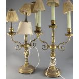 A pair of gilt brass candelabra, circa 1900, the three branches with lobed drip pans, on compound