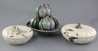 A Chinese Shiwan pottery model of four peaches in a dish and two porcelain gourd shaped boxes and