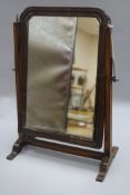 A toilet mirror H.41cm, W.27cm