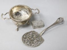 A, 1920's Asprey & Co silver tea strainer and stand, a German silver server and a sterling silver