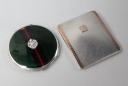 A Goldsmiths & Silversmiths parcel gilt silver cigarette case and a silver and enamel compact with