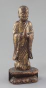 A Chinese giltwood figure of a Luohan, Ming dynasty or earlier, in standing pose, his hands held