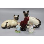 Four Beswick pottery cats, and a Royal Doulton flambe cat (5)