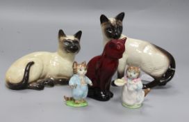 Four Beswick pottery cats, and a Royal Doulton flambe cat (5)