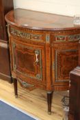 A Louis XVI ormolu mounted and banded kingwood and mahogany 'D' shaped side cabinet W.113cm