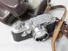 A Leica camera and case