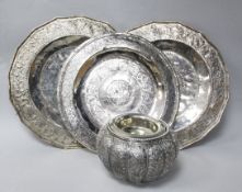Three Indian white metal dishes and a bowl and an Indian repousse white metal bowl.