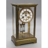 A Victorian brass four glass mantel clock, with mercury pendulum and R & Cie movement, height 30cm