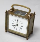 A 'Eureka' gilt brass carriage clock, with white enamelled dial, in outer wooden carrying case