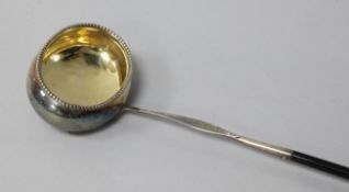 A George III silver toddy ladle with baleen handle, 41cm.