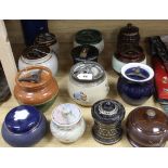 A Bourne Denby moulded tobacco jar and fifteen other tobacco jars, various (16)