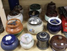 A Bourne Denby moulded tobacco jar and fifteen other tobacco jars, various (16)