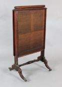 A Regency mahogany firescreen with sliding panels, H.3ft 6in. W.1ft 11in.https://www.gorringes.co.
