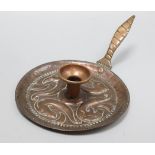 A John Pearson copper candle holder, signed, diameter 20cm