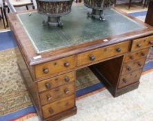 A Victorian mahogany nine drawer pedestal desk W.122cm