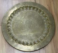 An Indian engraved brass tray, diameter 57.5cm