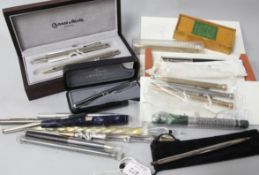 A group of assorted fountain pens, pencils and accessories