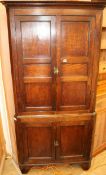 An oak corner cabinet, W.94cm