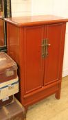 A Chinese red lacquer corner cabinet, W.68cm