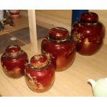 Two Carlton Ware Rouge Royale Pagoda ginger jars and covers and a smaller similar pair (one cover