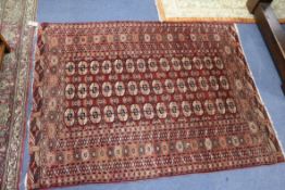 A Bokhara rug and two other rugs, in poor condition (3)