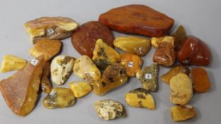 Approximately twenty six pieces of assorted raw amber.