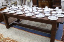 A stained pine refectory dining table W.244cm