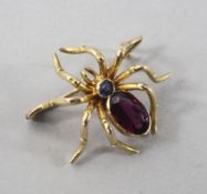 A gem set yellow metal spider brooch, 26mm.