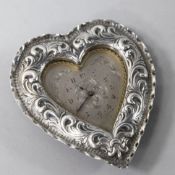 A late Victorian repousse silver mounted heart shaped timepiece, by Charles Mappin, London, 1888,