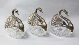 A matched set of three modern repousse silver mounted cut glass sweetmeat dishes modelled as