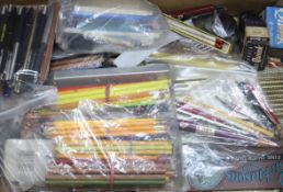 A quantity of writing equipment, including pens and pencils