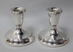 A pair of modern silver dwarf candlesticks, 9cm, weighted.