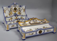 A Gien faience stationery rack, c.1890, with three stepped compartments painted with grotesques,