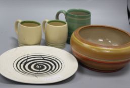 A Susie Cooper Crown Works plate, a hand signed vase, three mugs and a bowl