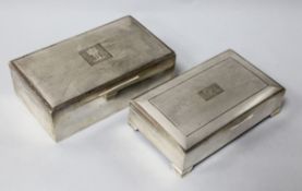 Two silver rectangular cigarette boxes, tallest 15.8cm.