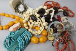 A quantity of mixed bead necklaces, cameo brooches etc.