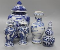 An Asian blue and white inverted pyriform jar and cover, a similar pair of smaller vases and two