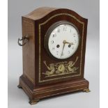 An Edwardian inlaid mahogany mantel clock, decorated with fauns, Mougin movement striking on a gong,