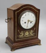 An Edwardian inlaid mahogany mantel clock, decorated with fauns, Mougin movement striking on a gong,
