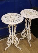 A pair of cast iron plant pot tables, W.36cm