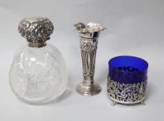 A silver topped scent bottle, a posy vase and a Dutch silver holder with glass liner.