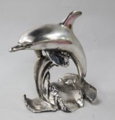 A silvered model of a dolphin