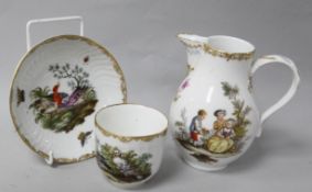 A Berlin cup and saucer, painted with birds and insects, and a Meissen baluster cream jug, painted